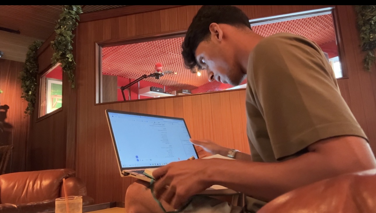 Working on Random Ten at a laptop